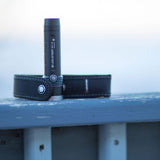 Ledlenser MT10 torch standing beside a belt pouch on a frosty rail