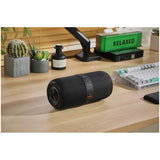 Maplin party speaker on a wooden desk next to plants and a keyboard