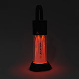 Ledlenser ML6 lantern glowing red on its stand in the dark