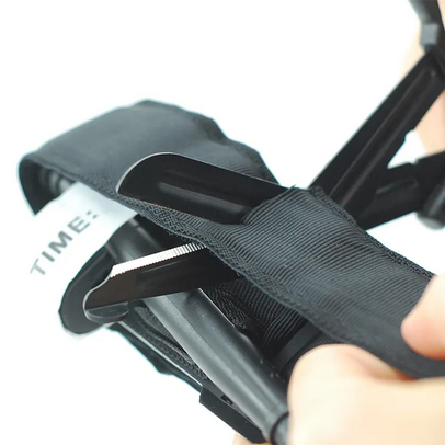 Tough Cut Shears cutting through a tourniquet strap
