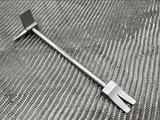 8 in Titanium Hooligan Bar lying on carbon fibre weave