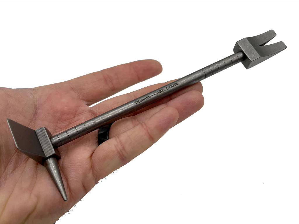 8 in Titanium Hooligan Bar resting across an open hand to show its size