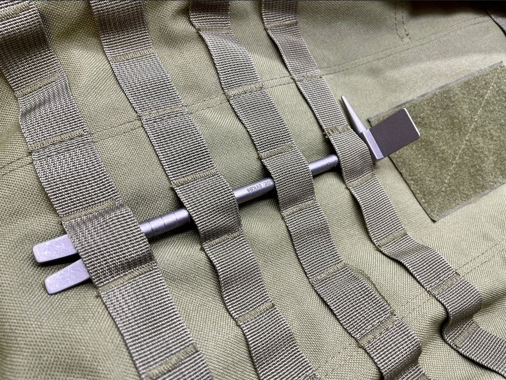8 in Titanium Hooligan Bar carried through webbing on a pack panel