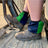 Navy and emerald green harlequin sox savers worn over work boots