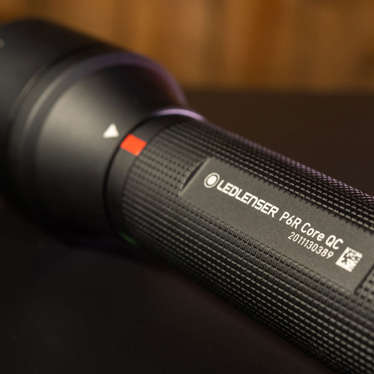 Close-up of the Ledlenser P6R Core QC name plate and red colour marker