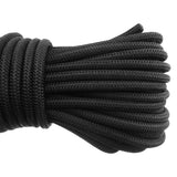 Close-up of the coiled black bungee rope from the Green/Brown L-Grade Tarpaulin with 10m of 6mm Bungee Rope and 10 x Screw Type Tarp Clips