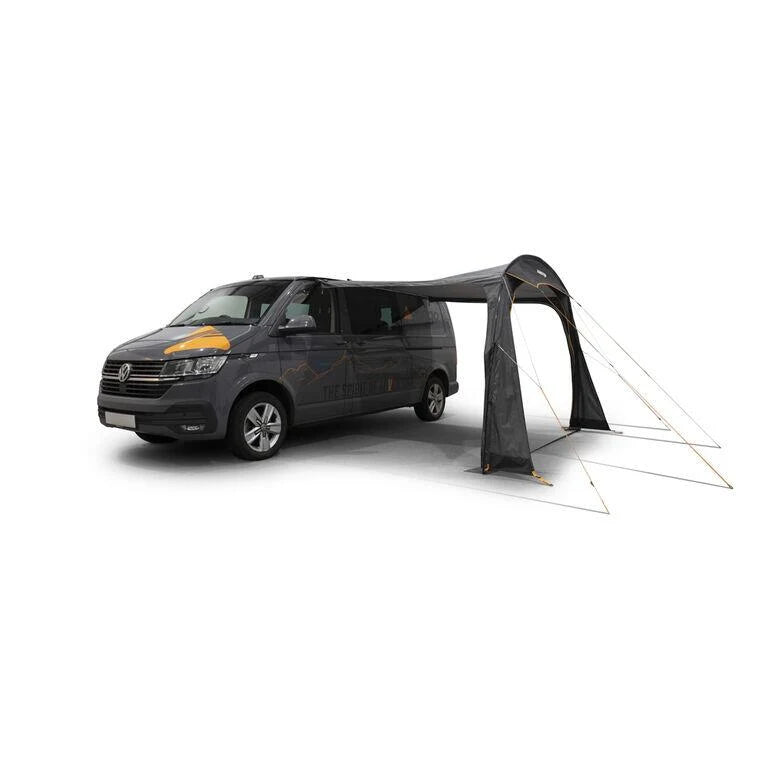 Vango Sunlight used as an open sun canopy beside a campervan