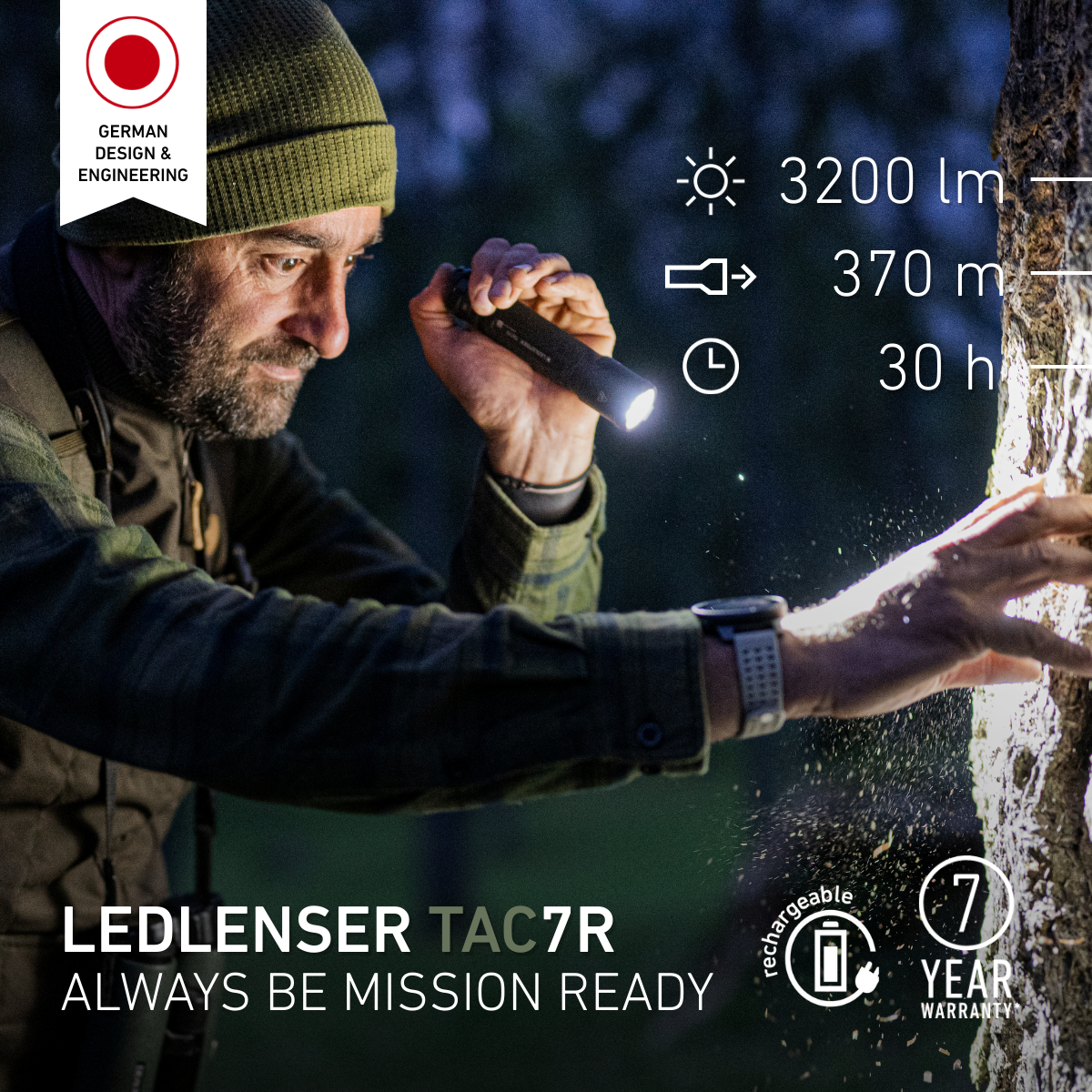 Man examining a tree trunk at night with the Ledlenser TAC7R torch, with 3200 lumens, 370m and 30 hour figures