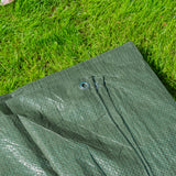 Close-up of the Green S-Grade Tarpaulin 5m x 5m on grass with an eyelet in the hem
