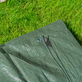 Green S-Grade Tarpaulin 4m x 6m on a lawn with a black reinforced corner and eyelet