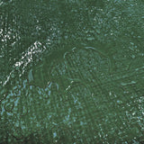 Close-up of water sitting on the woven surface of the Green M-Grade Tarpaulin 1m x 1m