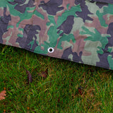 Camouflage M-Grade Tarpaulin 1m x 1m folded with one corner turned back to show the eyelets