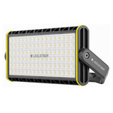 Ledlenser AF12R Work area light in its pivoting U-bracket, showing the wide panel of warm and cool white LEDs