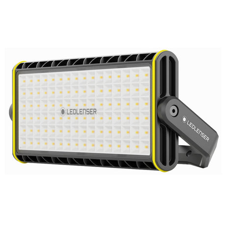 Ledlenser AF12R Work area light in its pivoting U-bracket, showing the wide panel of warm and cool white LEDs