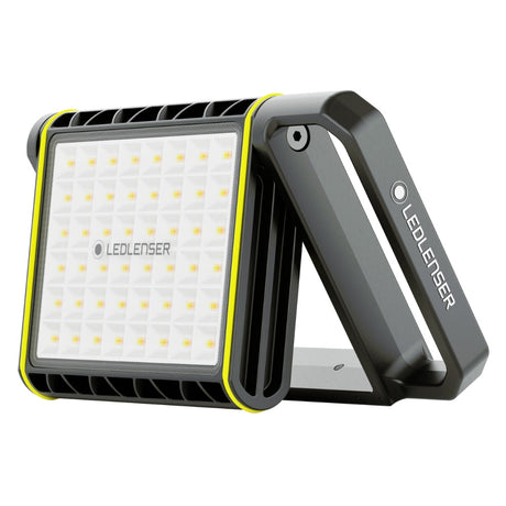 Ledlenser AF8R Work area light standing on its fold-out handle, showing the square panel of warm and cool white LEDs