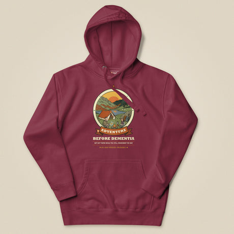 Adventure Before Dementia Camping Hoodie in Maroon, laid flat, front view