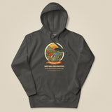 Adventure Before Dementia Camping Hoodie in Vintage Black, laid flat, front view