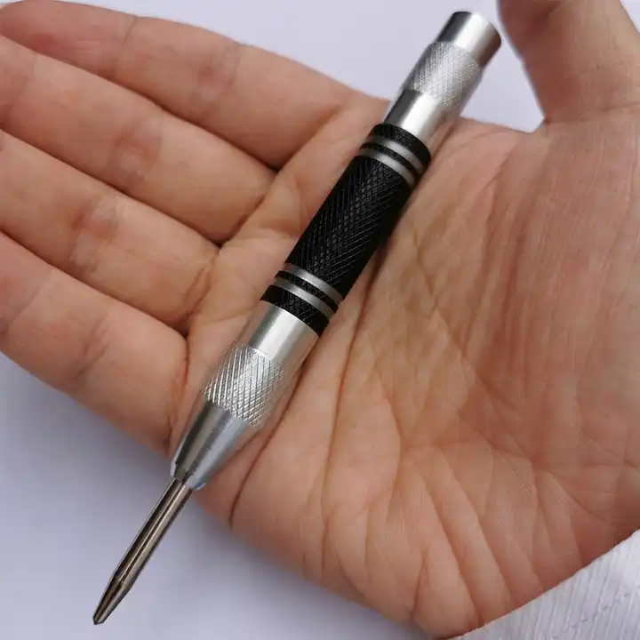 Heavy Duty Glass Breaker Punch lying across an open hand to show its size
