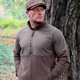 Jack Pyke Bleasdale Half Zip Fleece Top in dark olive on a man outdoors
