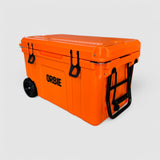 Orbie 55 cool box in orange at an angle, folding steel tow handle extended and the moulded lid ruler visible