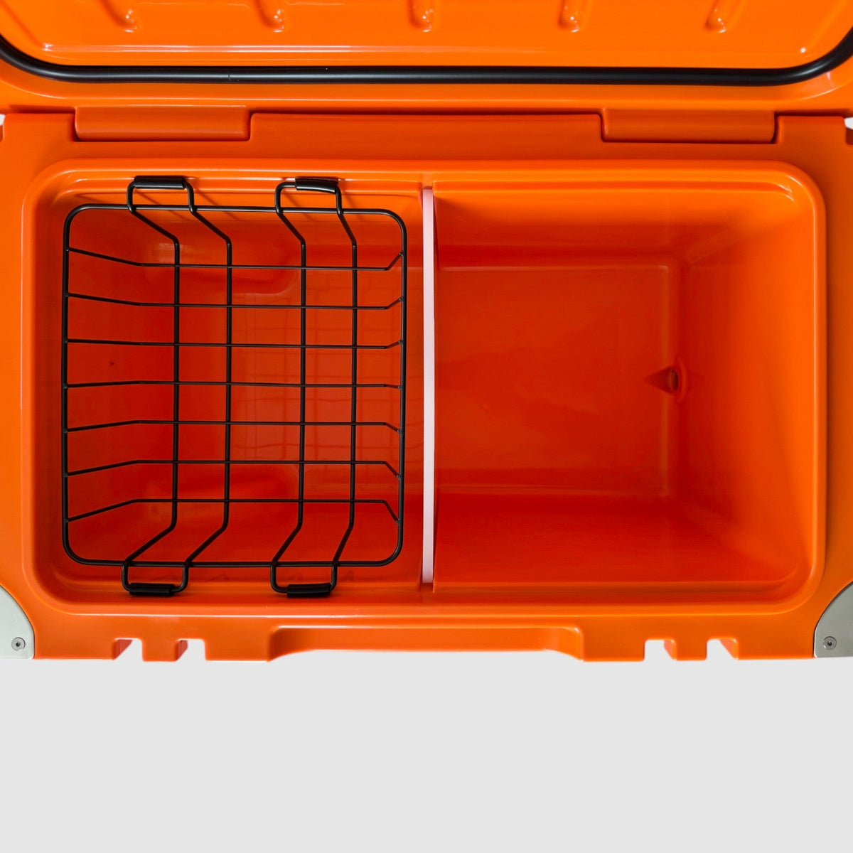 Inside the orange Orbie 55 cool box with the wire basket and white divider fitted