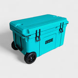 Orbie 55 cool box in turquoise closed at an angle, with the rope carry handle and wheels at the near end