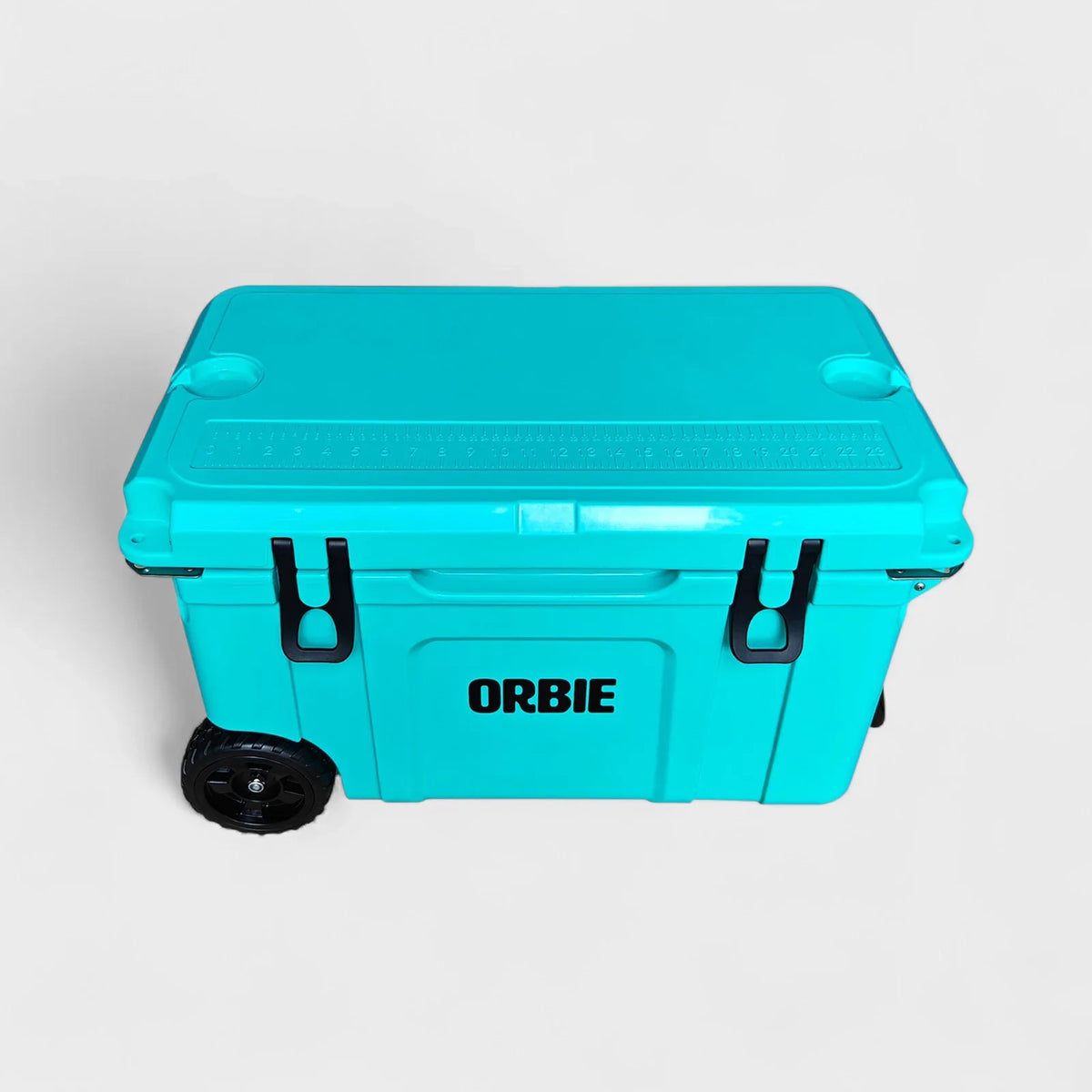 Orbie 55 cool box in turquoise from above at an angle, with the moulded lid ruler and both cup holders in view