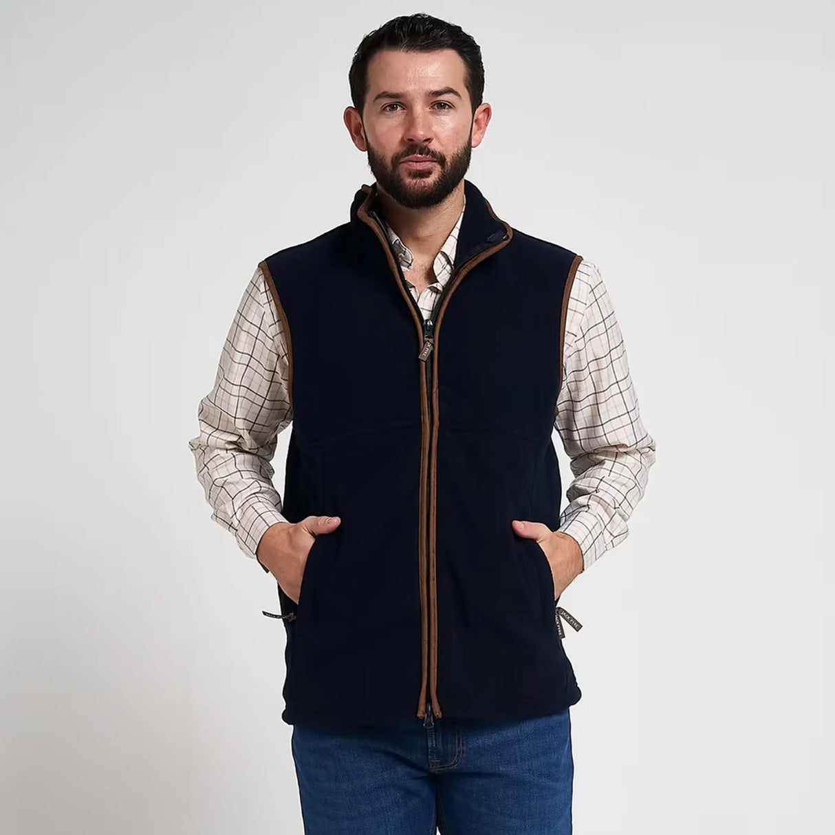 Jack Pyke Countryman Fleece Gilet in Navy Blue from the front hands in pockets on white background