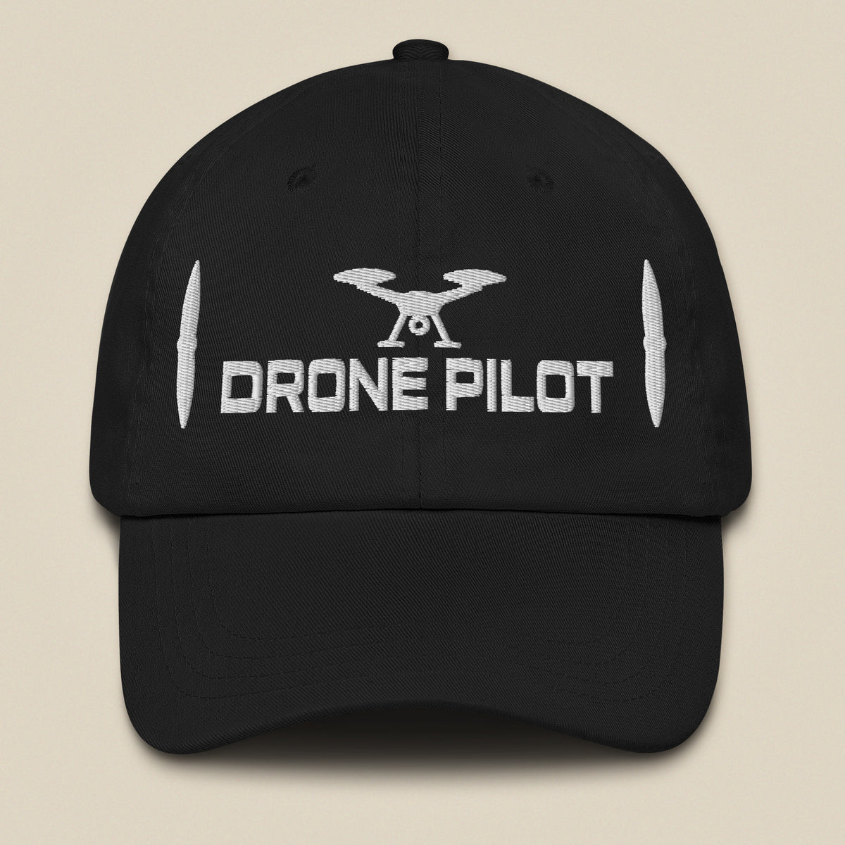 Task "Drone Pilot" cotton twill cap in Black, front view with white embroidered drone, DRONE PILOT text and propeller blades