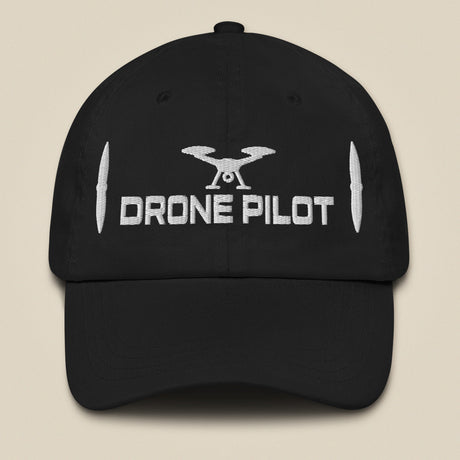 Task "Drone Pilot" cotton twill cap in Black, front view with white embroidered drone, DRONE PILOT text and propeller blades