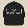 Task "Drone Pilot" cotton twill cap in Black, front view with white embroidered drone, DRONE PILOT text and propeller blades