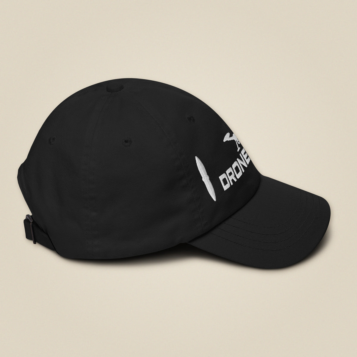 Task "Drone Pilot" cap in Black, side view with the brim to the right, showing the low-profile crown