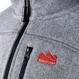 Sugar Loaf Fell Half Zip Fleece Top in Ash Grey close up of logo on chest