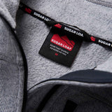 Sugar Loaf Fell Half Zip Fleece Top in Ash Grey close up of branding on collar
