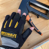 Ironclad Framer Gloves - back of hand view showing FRAMER branding and TPR knuckle protection in the outdoors