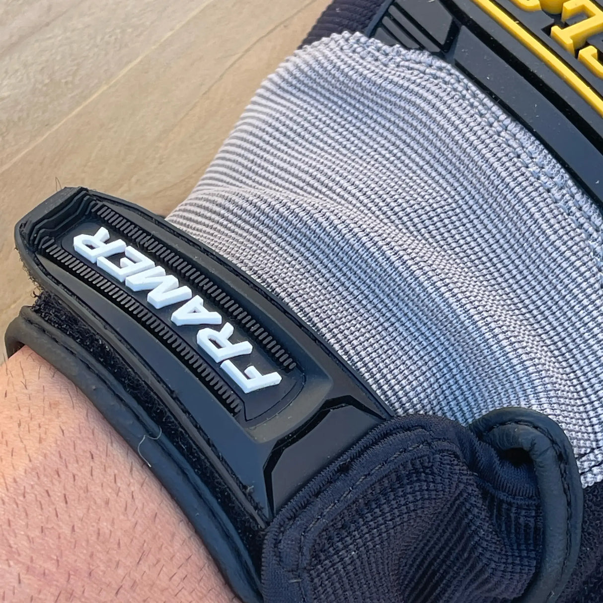 Ironclad Framer Gloves - back of hand view showing Framer branding on cuff and breathable stretch material