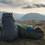 Highlander Hawk Waterproof Bivvy Bag being used outdoors - for survival
