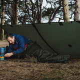 Highlander Hawk Waterproof Bivvy Bag being used outdoors - with a basha