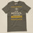 Task "In My Defence, I Was Left Unsupervised" T-shirt in Army, laid flat, front view with distressed stencil slogan and hazard stripes