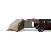 Kelty Caboose 4 Vehicle Tent - Smoke Beluga Dull Gold pitched with awning