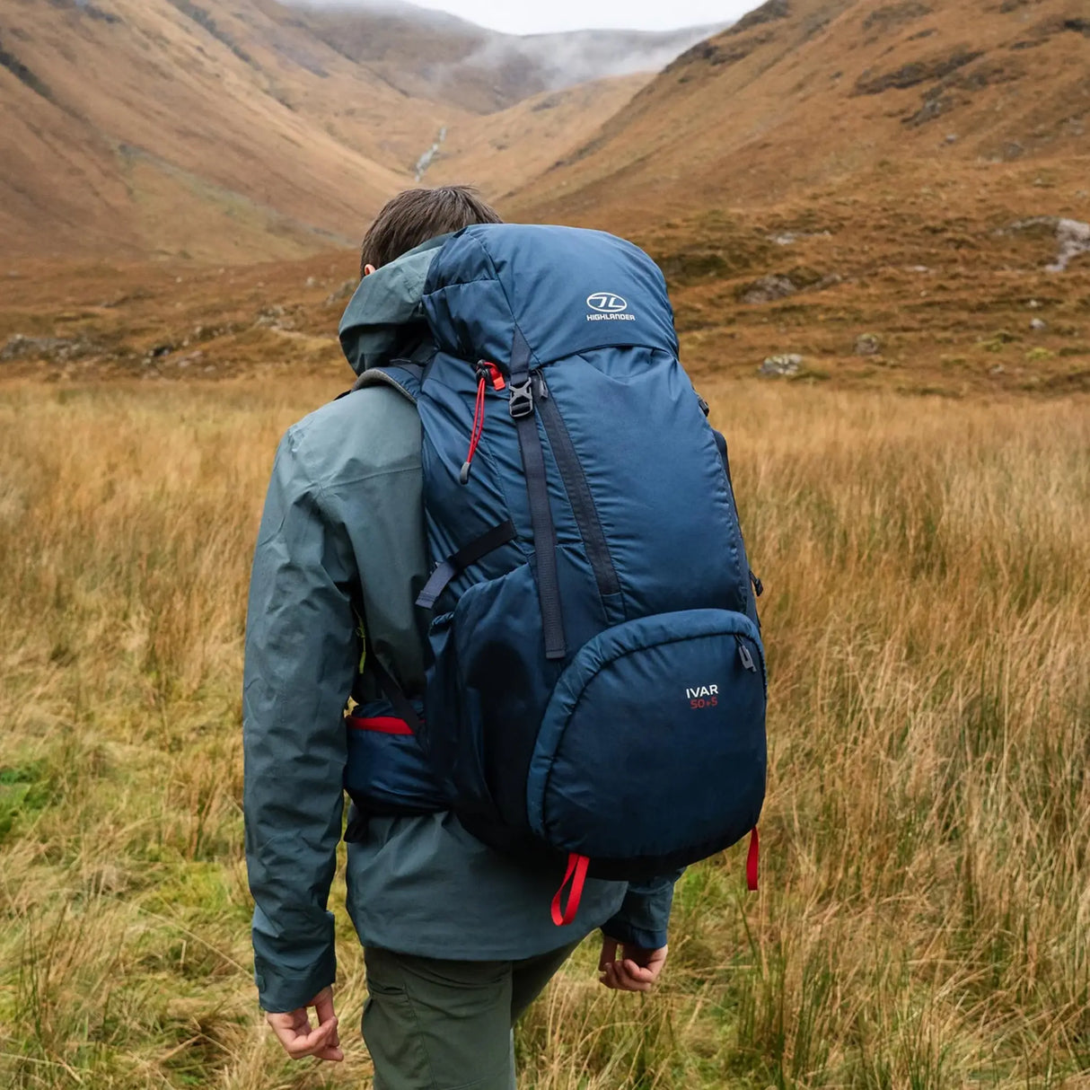 Highlander Ivar Men's Rucksack 50L - Navy Blue worn by hiker in a Highland glen