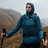 Highlander Ivar Women's Rucksack 50L - Navy Blue worn by hiker with walking poles in misty hills