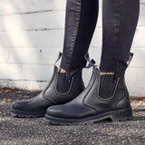 Mongrel K9 Dealer Boot - Black worn standing against a white wall