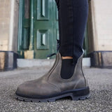 Mongrel K9 Dealer Boot - Cloudy Grey worn outdoors by a green door
