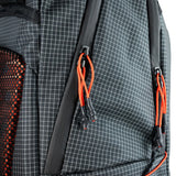 Highlander Kynetik Rucksack 25L in Black - close-up of the twin zip pullers and orange bungee toggle