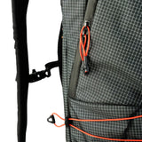 Highlander Kynetik Rucksack 25L in Black - close-up of the side pocket, waist strap buckle and bungee cord