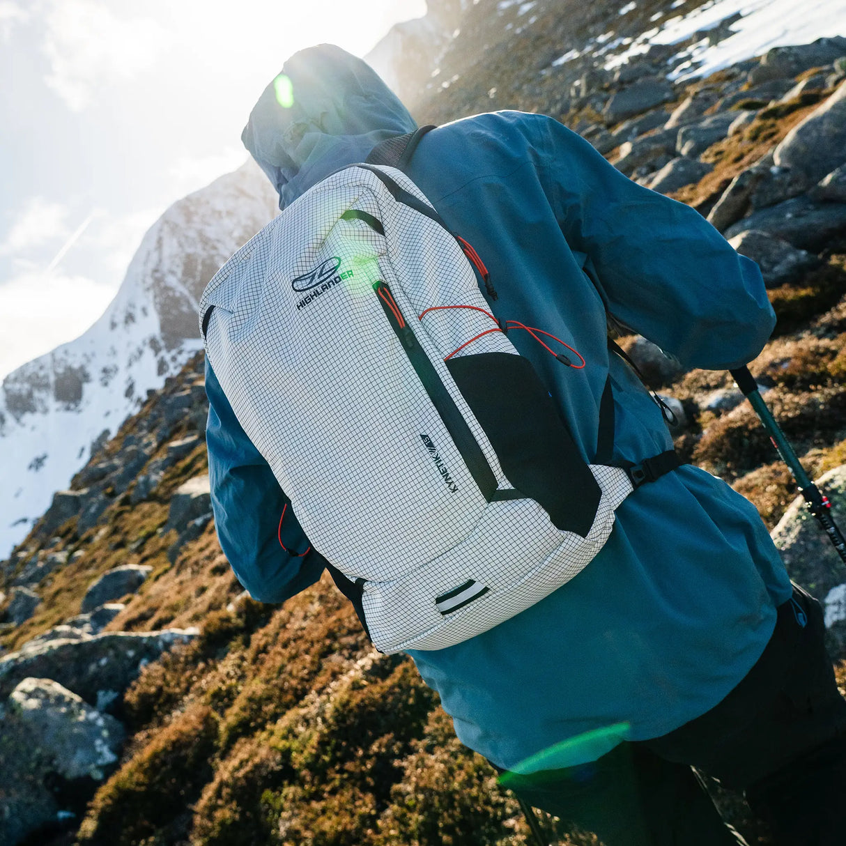 Highlander Kynetik Rucksack 15L in White - overhead view worn by a hiker ascending a heather slope