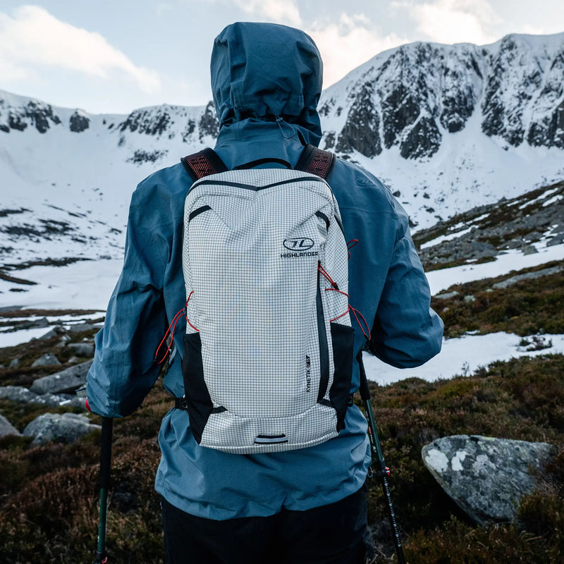 Highlander Kynetik Rucksack 15L in White - worn by a hiker facing a snow-covered corrie