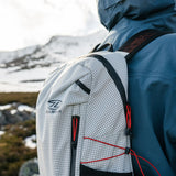 Highlander Kynetik Rucksack 15L in White - over-the-shoulder close-up of the top of the pack and zip cords