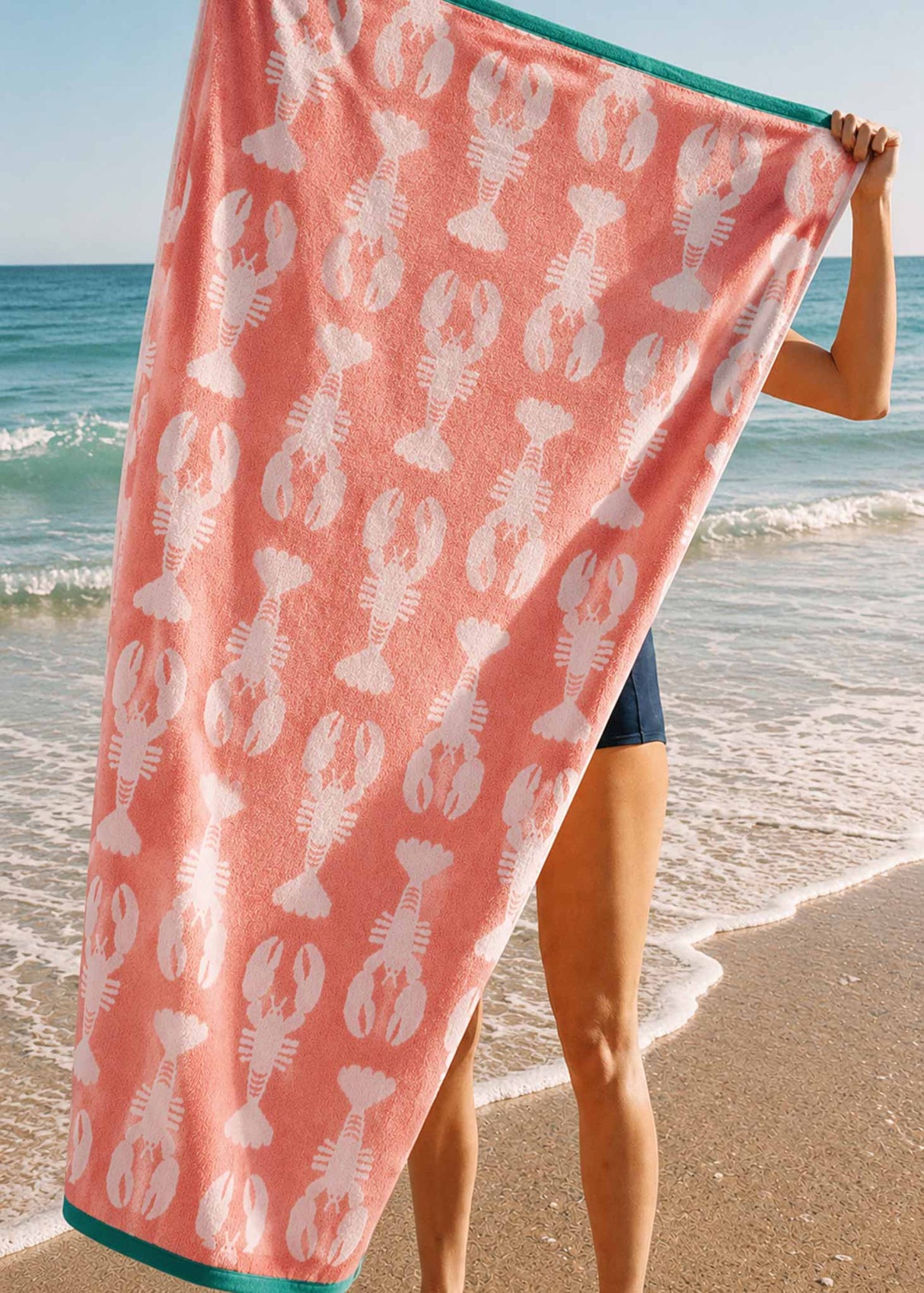 Anorak Lobsters Pink Organic Cotton Towel - Soft pink and white carried on the beach